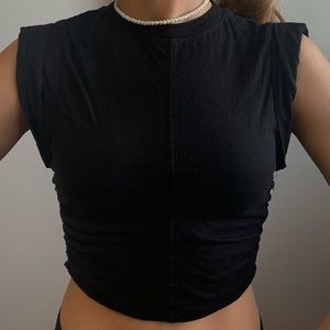Black crop top with a detail at the side - swipe to see it